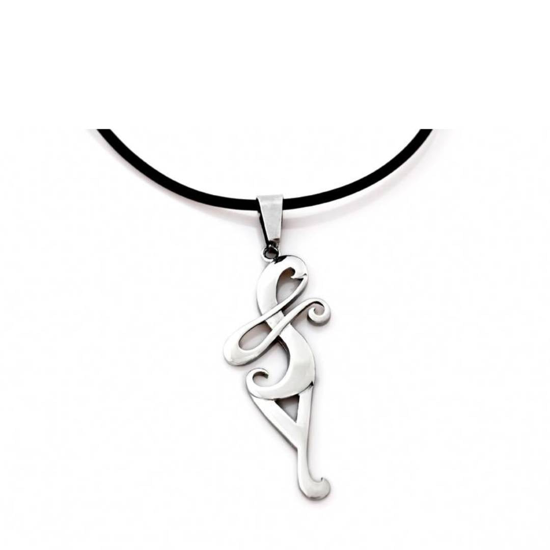 Lisa Tamati Koru necklace – silver pendant inspired by the unfurling fern symbolizing growth and new beginnings
